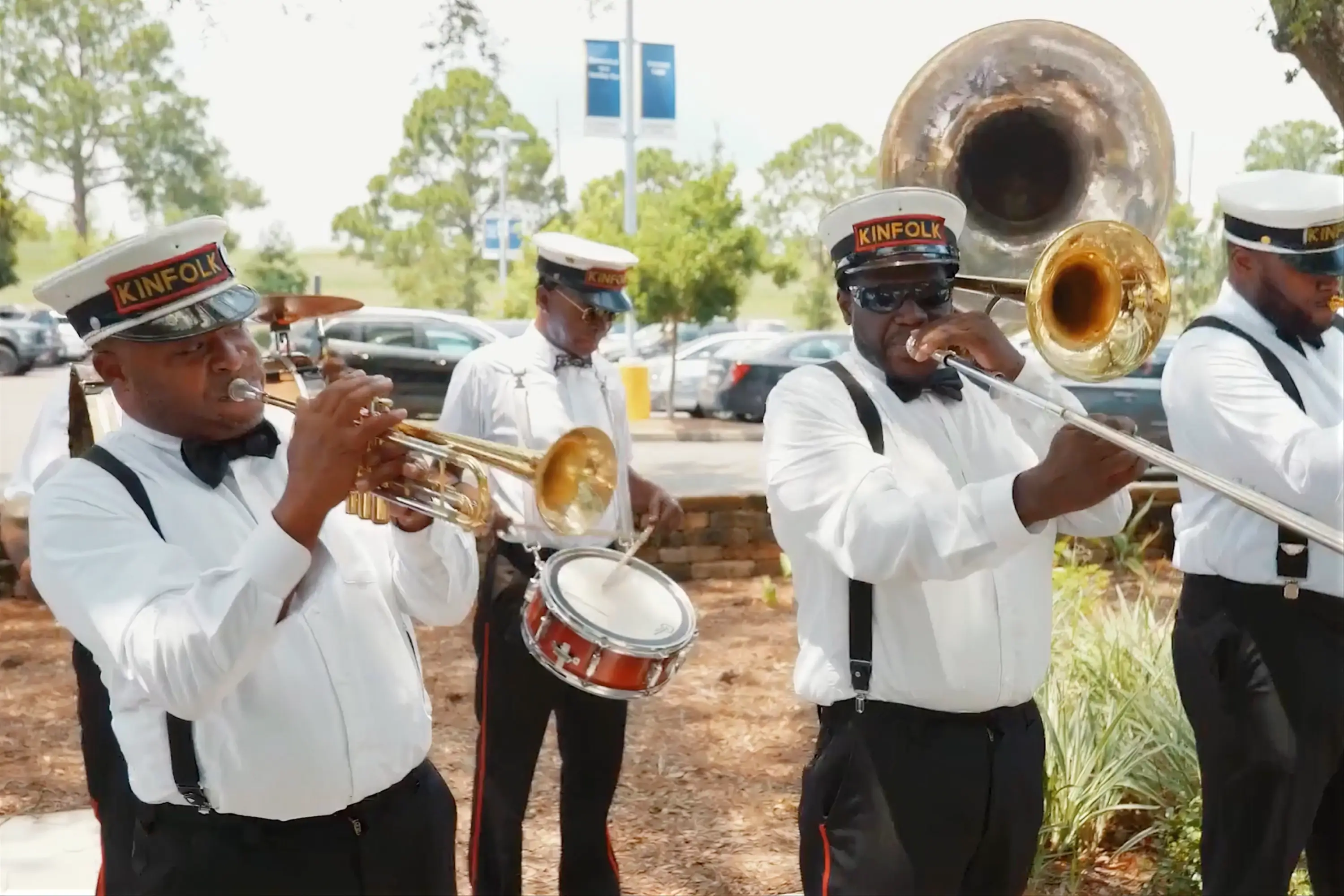 The Kinfolk band musicians playing instruments