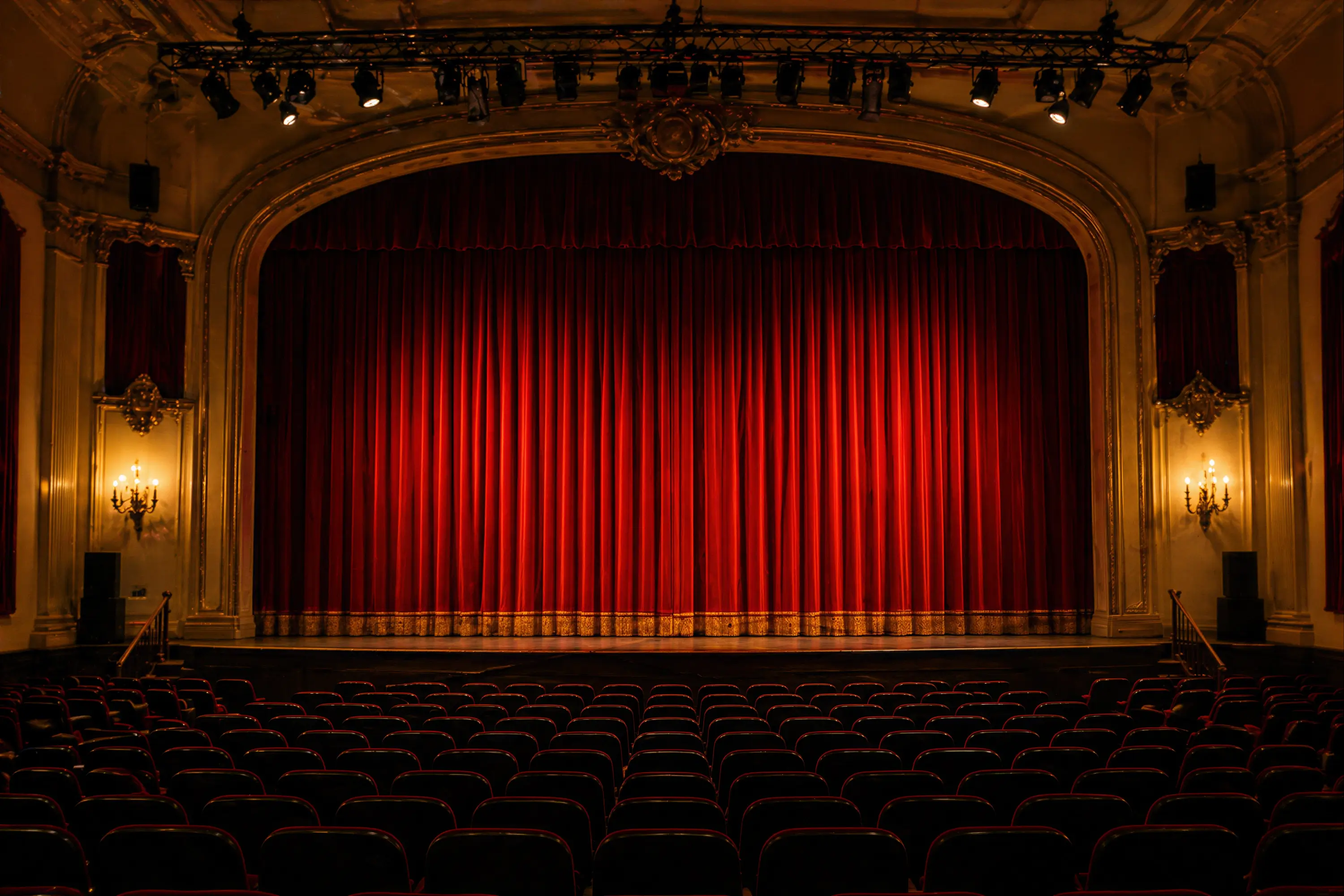Seats viewing a closed curtain in the Rivertown Theater